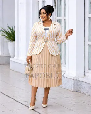 Women's Double-Breasted Blazer Paired With a Pleated Skirt