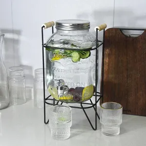 Glass Beverage Dispenser With a Metal Stand