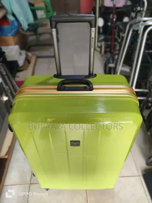 Japanese Bright Green Hardside Suitcase Is From the Brand Wintaro.