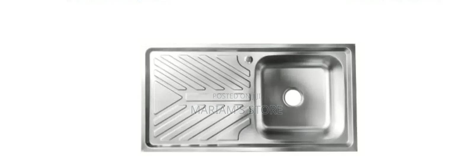 Stainless Steel Kitchen Sink Featuring a Single Bowl and Drainer.