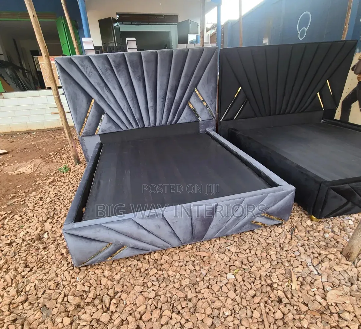 5by6 Gray Stripped Fabric Bed Next to Black