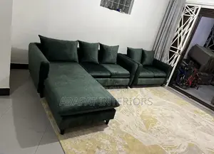 Elegant Dark Green Velvet L-Shaped Sectional Sofa.