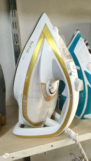 Uk Used Tefal Turbo Pro Anti-Calc Steam Iron in White and Gold.