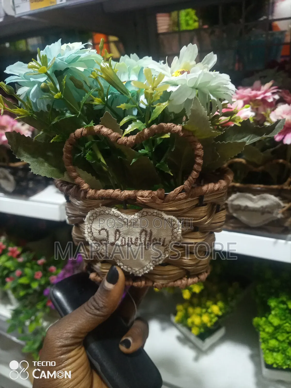 Artificial Flower Basket With Flowers and a Woven Container.