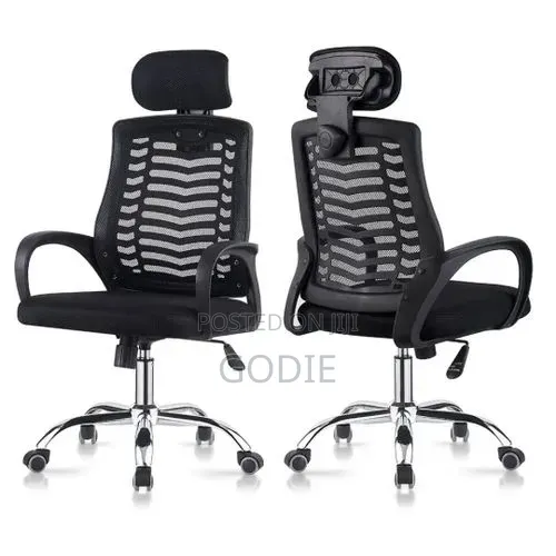 Modern Black Mesh Executive Office Chair With an Adjustable Headrest.