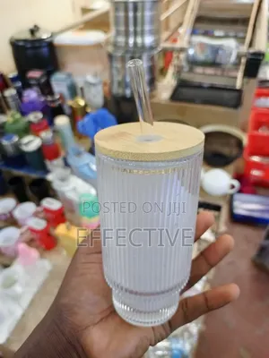Ribbed Glass Tumbler With a Natural Bamboo Lid and Glass Straw.
