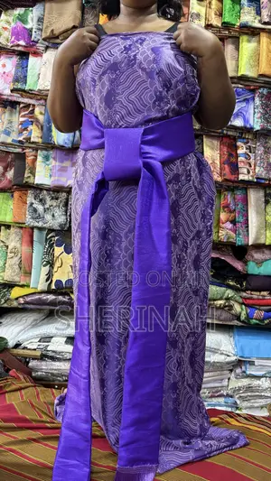 A Blue Gomesi With a Kitambala