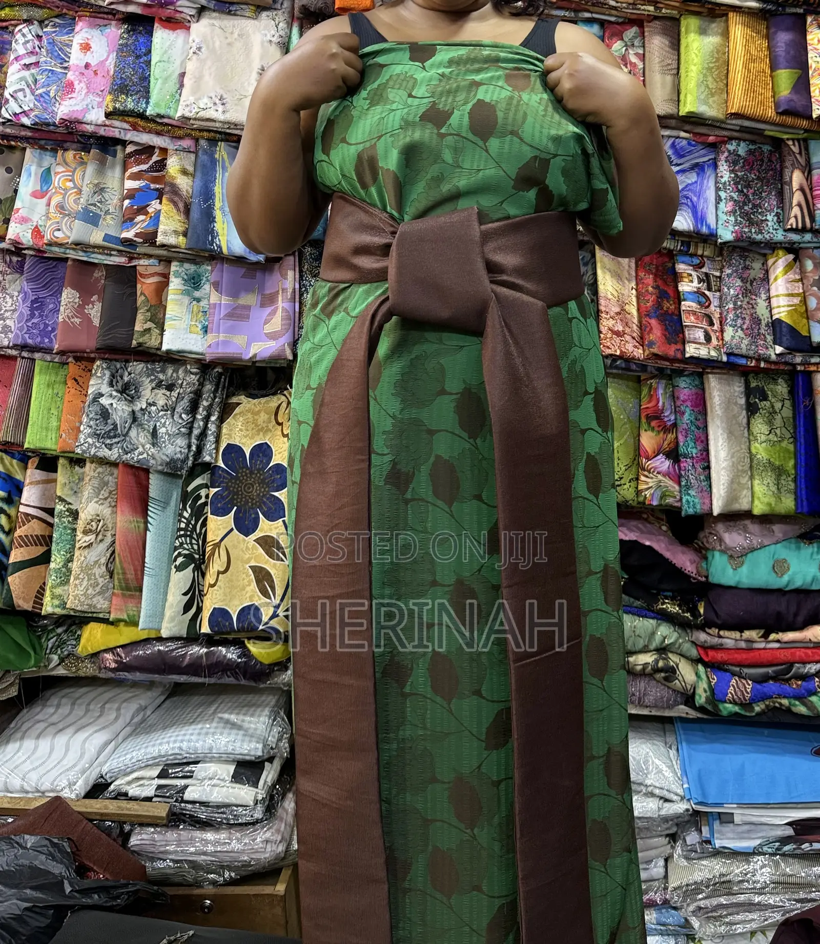 A Green Gomesi With a Kitambala