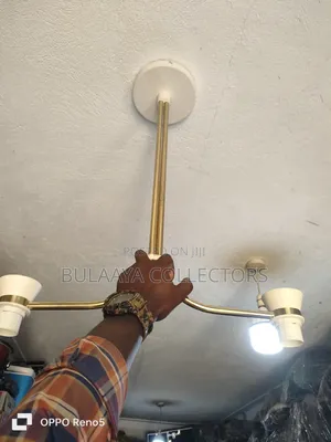 Uk Modern Brass-Plated Ceiling Light Fixture With a Two-Arm Design.