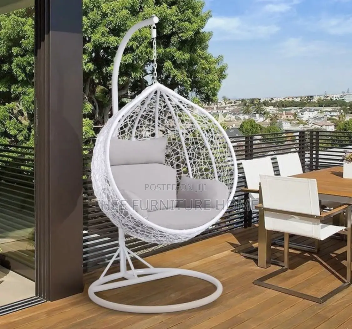 This Is a Yaheetech Garden Egg Swing Chair in White With Grey Cushions