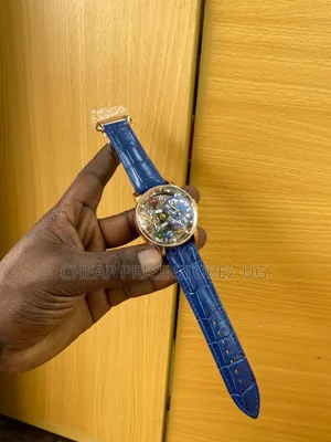 This Is a Jacob Co. Astronomia Solar Watch With a Blue Leather Strap