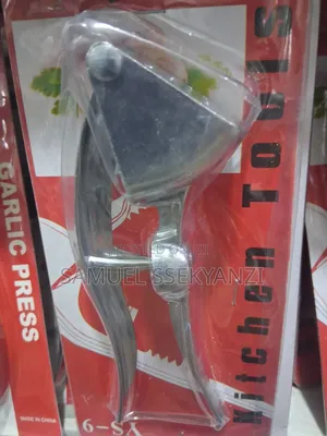 This Is a Manual Kitchen Garlic Press Utensil.
