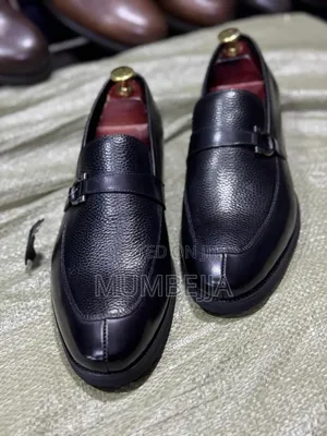 Original U and Leather Black Loafers With a Silver Buckle Strap