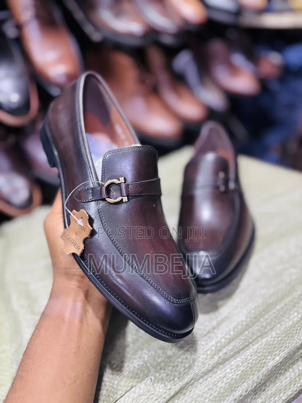 Original U and Leather Black Loafers With a Silver Buckle Strap