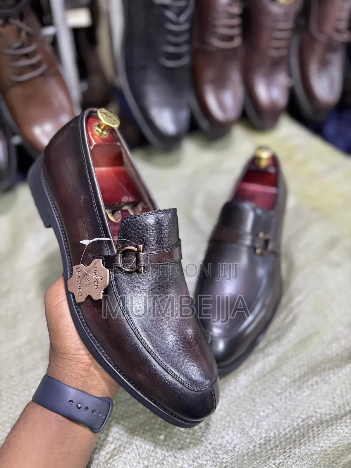 Original U and Leather Black Loafers With a Silver Buckle Strap
