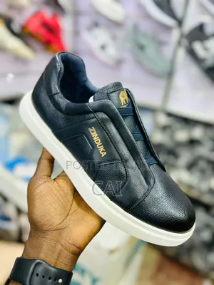 Navy Blue Zinduka Sneakers Featuring a Minimalist Slip-on Design