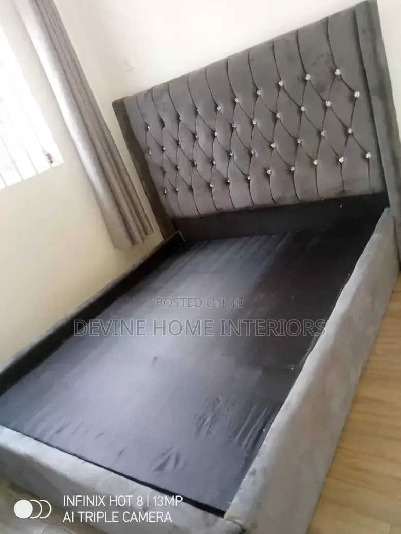 A Gray Upholstered Bed