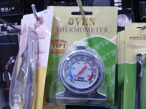 Oven Thermometer With A Stainless Steel Housing.