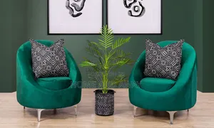 A Pair of Accent Sofas With a Center Flower Pot Any Colour