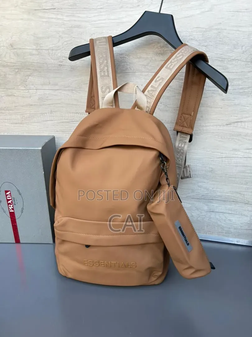Unisex Fear of God Essentials Backpacks Black, Olive, and Red.