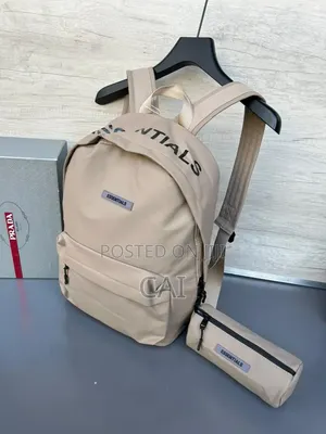 Unisex Fear of God Essentials Backpacks Black, Olive, and Red.