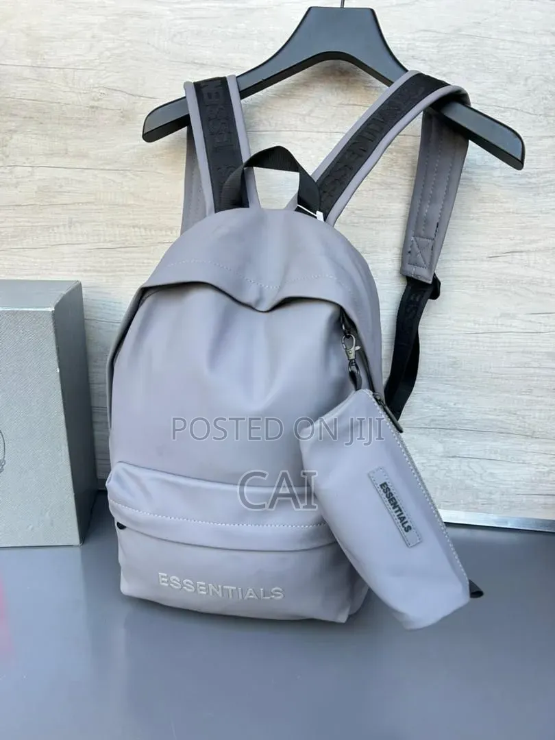 Unisex Fear of God Essentials Backpacks Black, Olive, and Red.