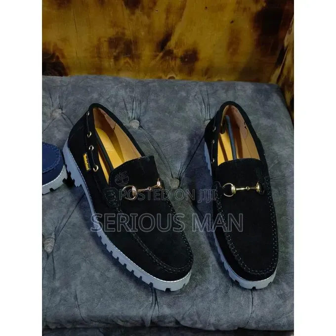 Timberland Men's Black Suede Horsebit Loafer With Prominent Lug Sole.