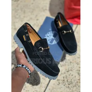 Timberland Men's Black Suede Horsebit Loafer With Prominent Lug Sole.