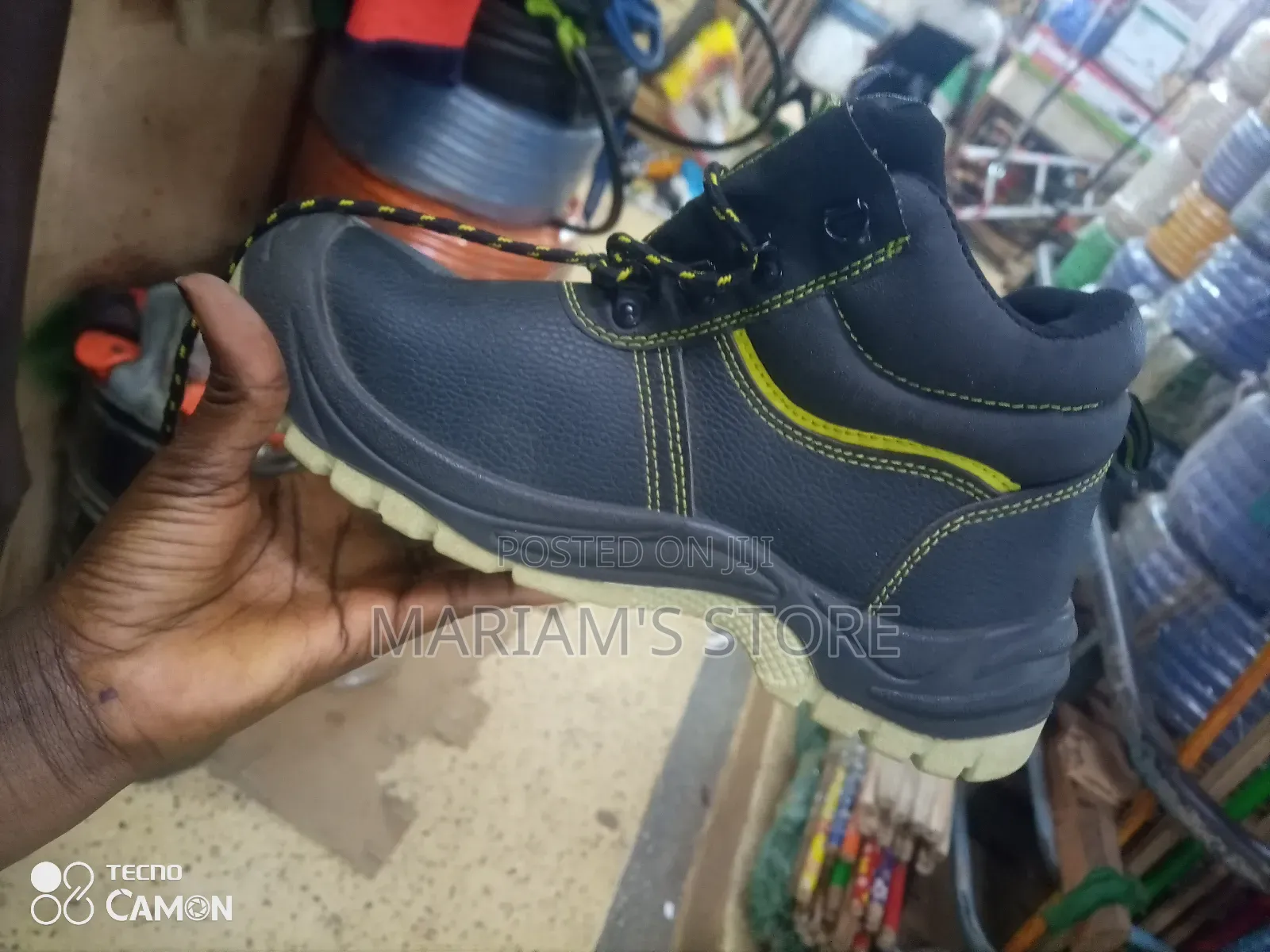 Black Industrial Safety Boots With Yellow Accent Stitches.