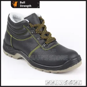 Black Industrial Safety Boots With Yellow Accent Stitches.