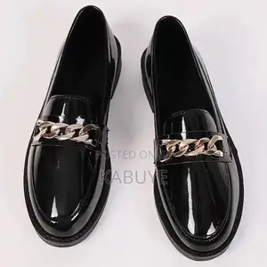Black Patent Loafers Featuring a Chunky Sole
