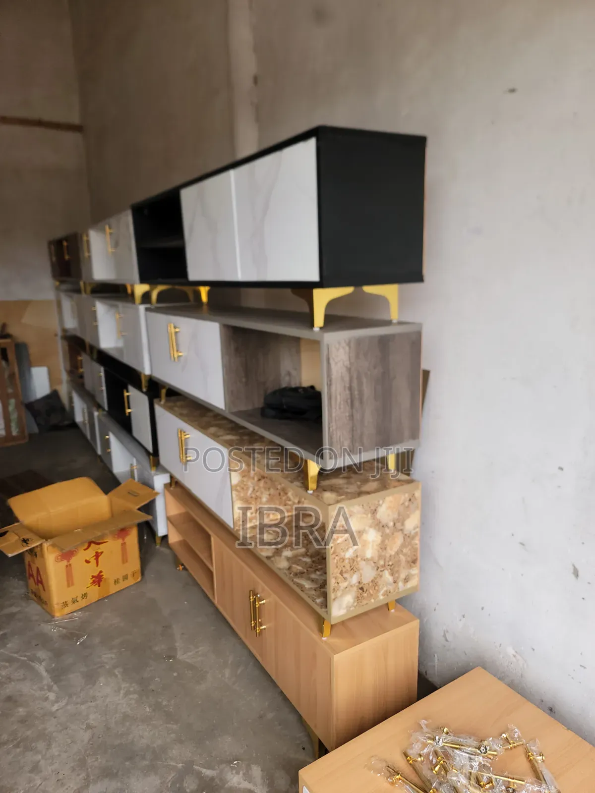 A Tv Stand With Golden Stands