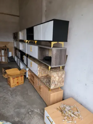 A Tv Stand With Golden Stands