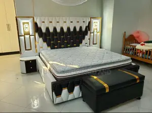 A Black and White Geometric Bed With Light