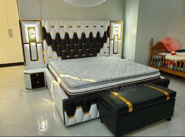 A Black and White Geometric Bed With Light