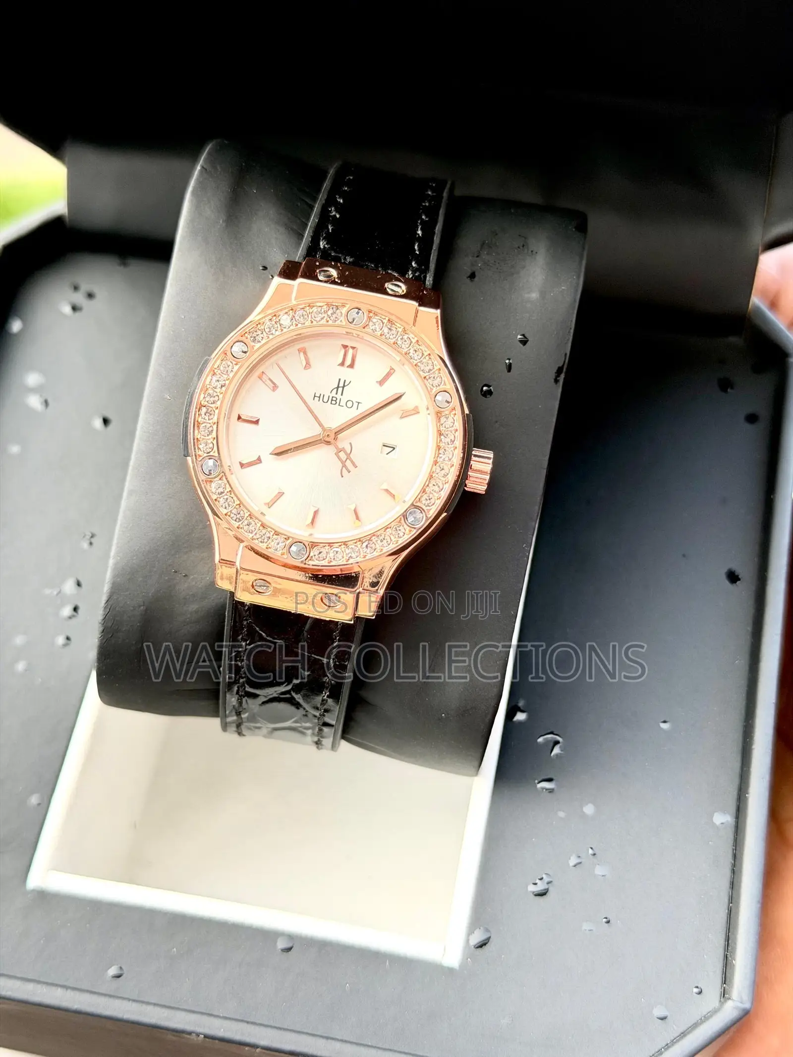 Black Ladys Watch With a Gold Head