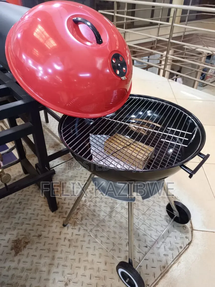 Round Portable Charcoal Barbecue Grill.