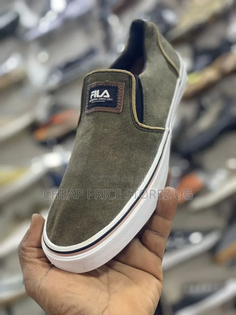 These Are Fila Olive Green Canvas Slip-on Sneakers.