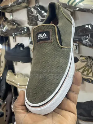 These Are Fila Olive Green Canvas Slip-on Sneakers.