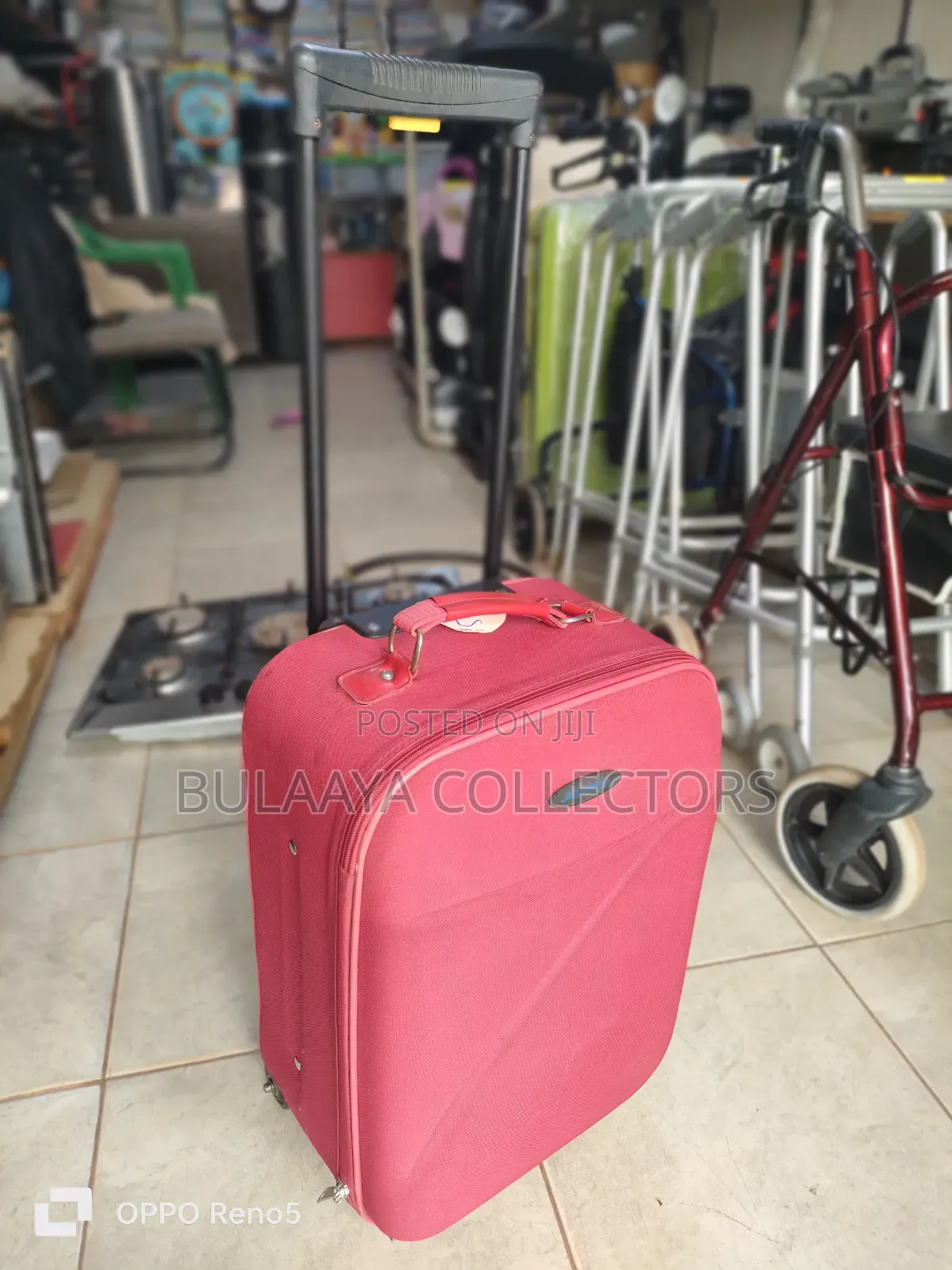 Japan Used Red, Soft-Sided Trolley Suitcase With a Telescopic Handle.