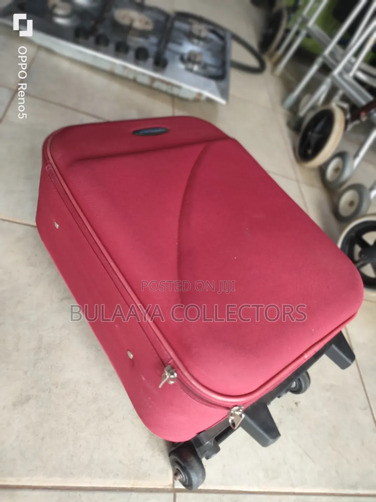 Japan Used Red, Soft-Sided Trolley Suitcase With a Telescopic Handle.
