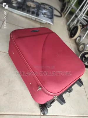 Japan Used Red, Soft-Sided Trolley Suitcase With a Telescopic Handle.