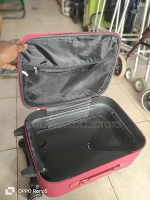Japan Used Red, Soft-Sided Trolley Suitcase With a Telescopic Handle.