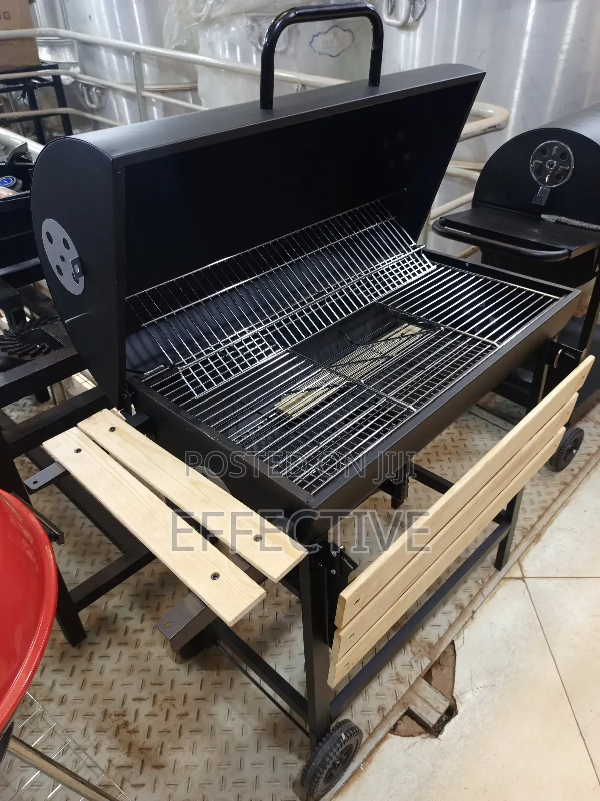 Metal Trolley Charcoal Barbecue Grill With a Wooden Shelf.