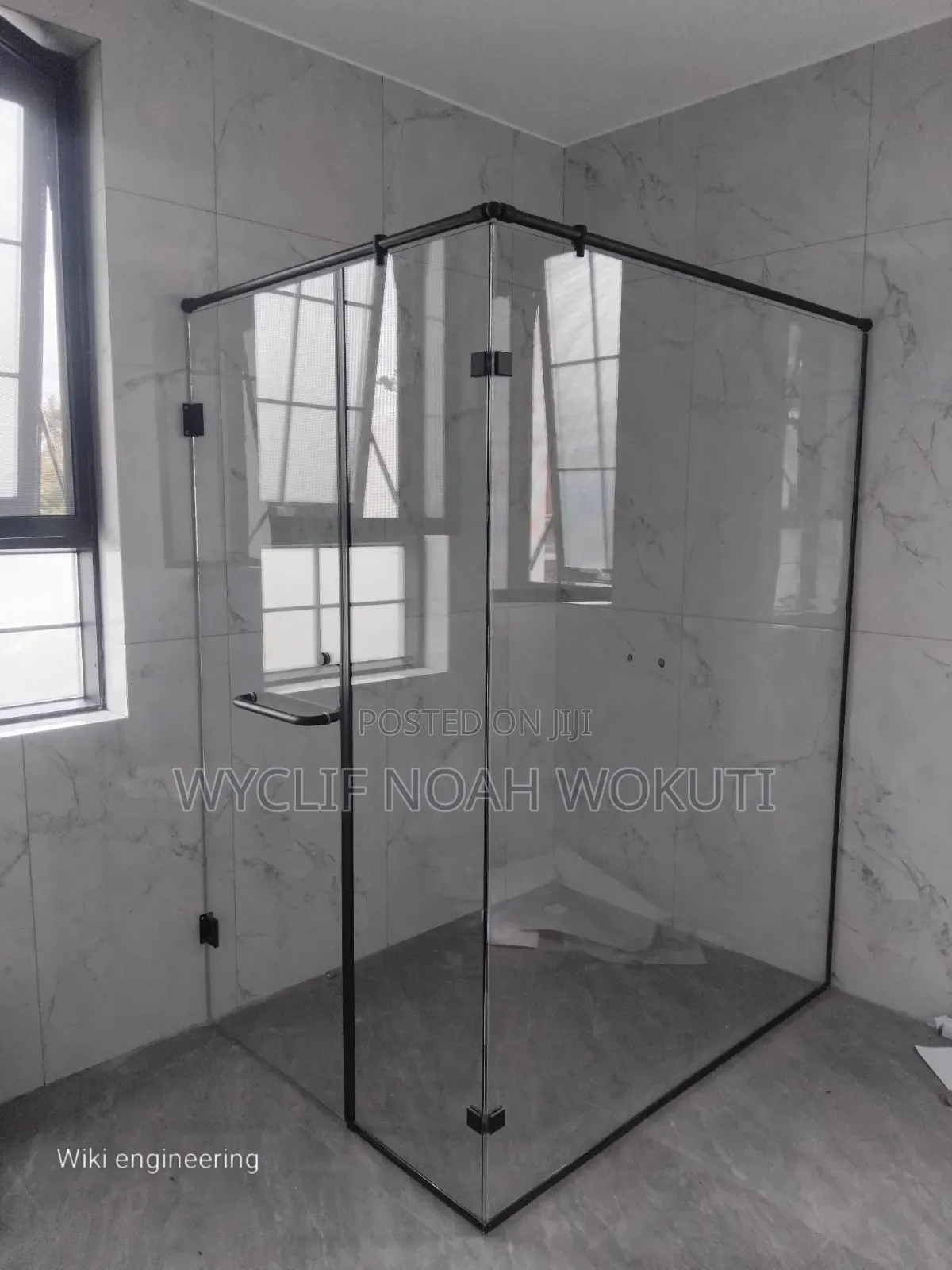 A Clear Shower Cabin With a Swing Door
