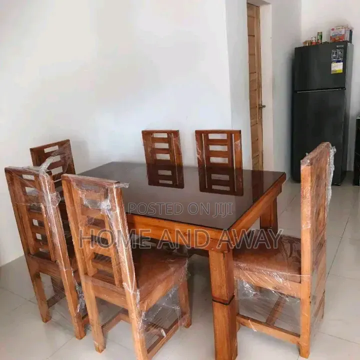 6 Seaters Glassed Wooden Dining Table Sets in Any Colour 2,000,000/-