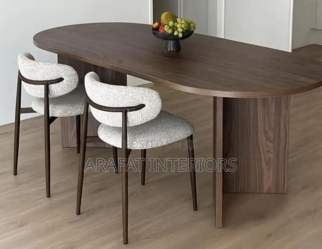 The Oval Walnut Table Paired With These Sculptural Bouclé Chairs