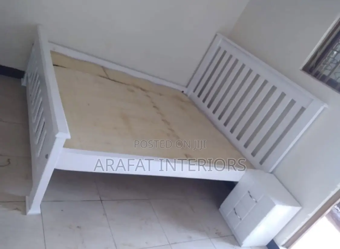 Clean and Simple White Wooden Twin Bed