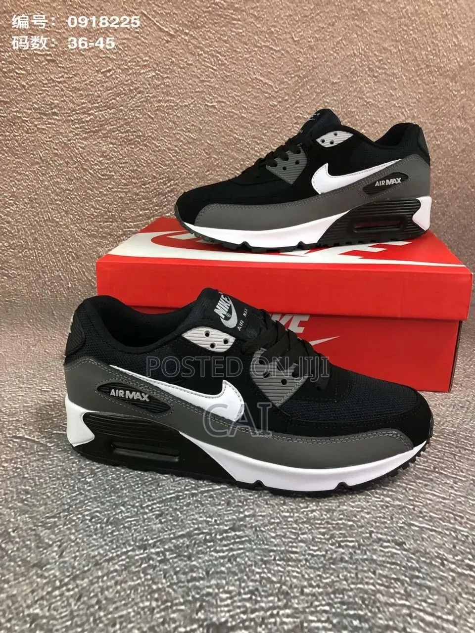 Nike Air Max 90 Sneakers in a Black, Cool Grey, and White