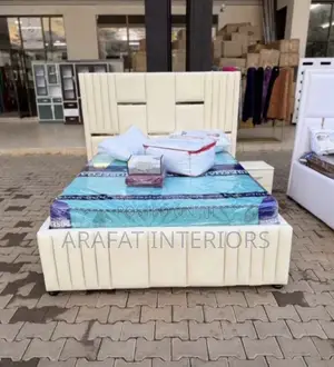 Stunning Modern Upholstered Bed Featuring a Tall Scalloped